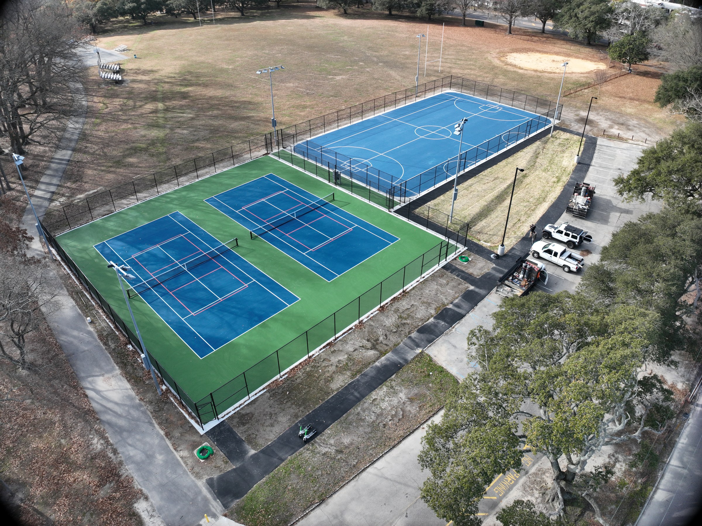 Completed tennis and street hockey courts viewed from above