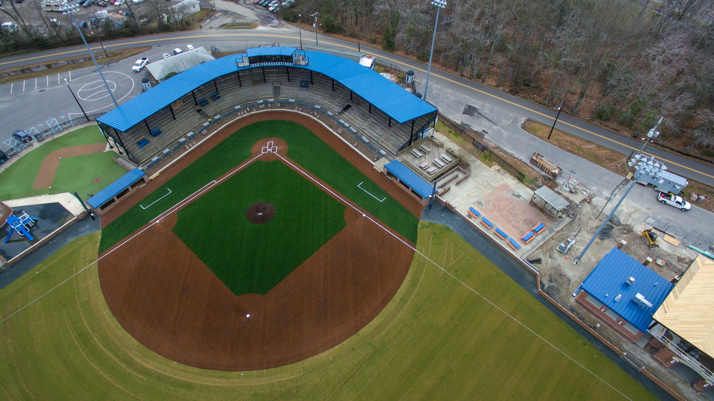 A closer aerial view of the artificial-turf infield and its connection to the grass outfield.