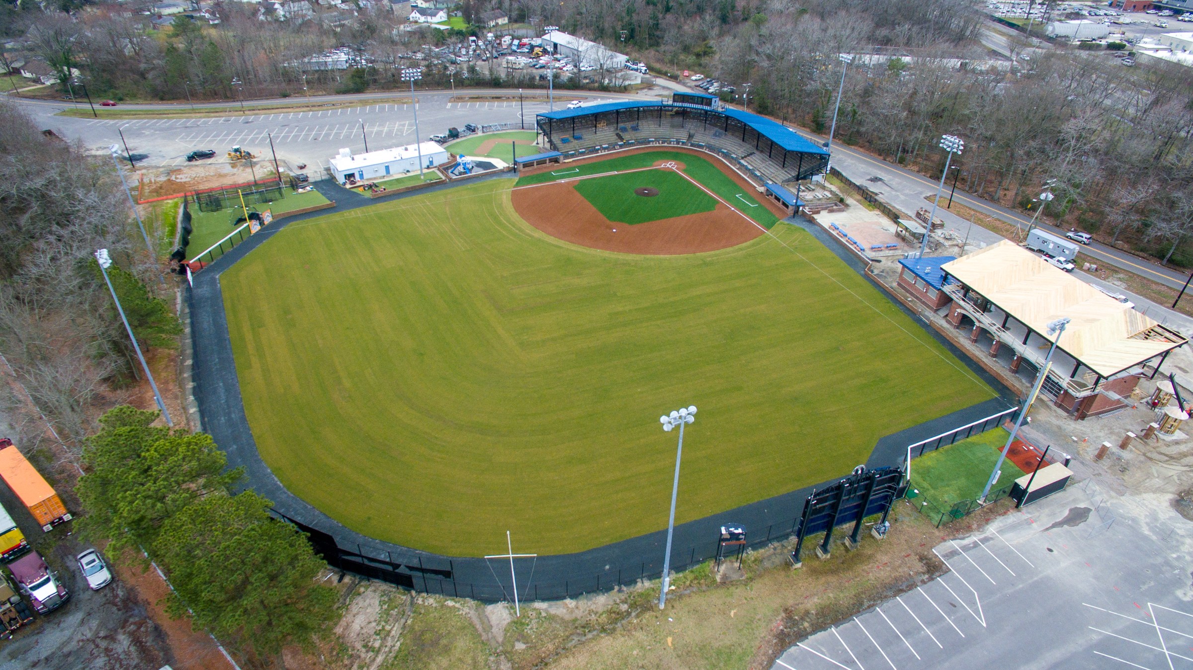 Aerial view of a baseball field with an artificial-turf infield and natural-grass outfield