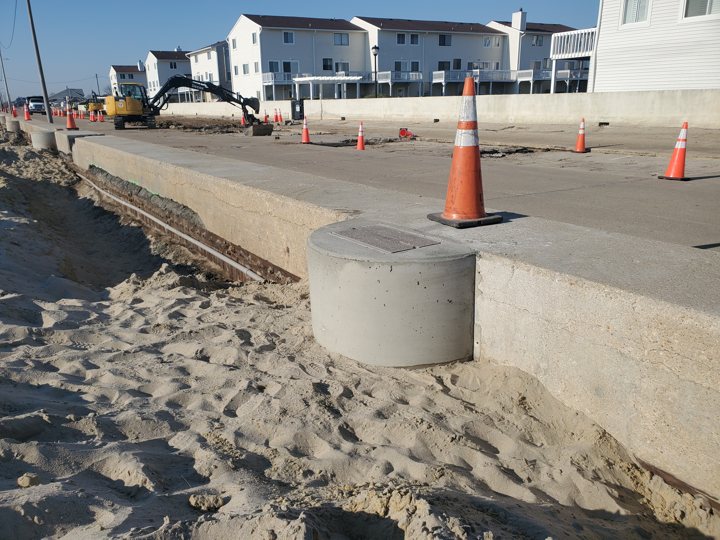 Completed shaped concrete foundation tied into the seawall