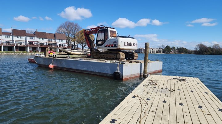 Process: barge beside the floating dock