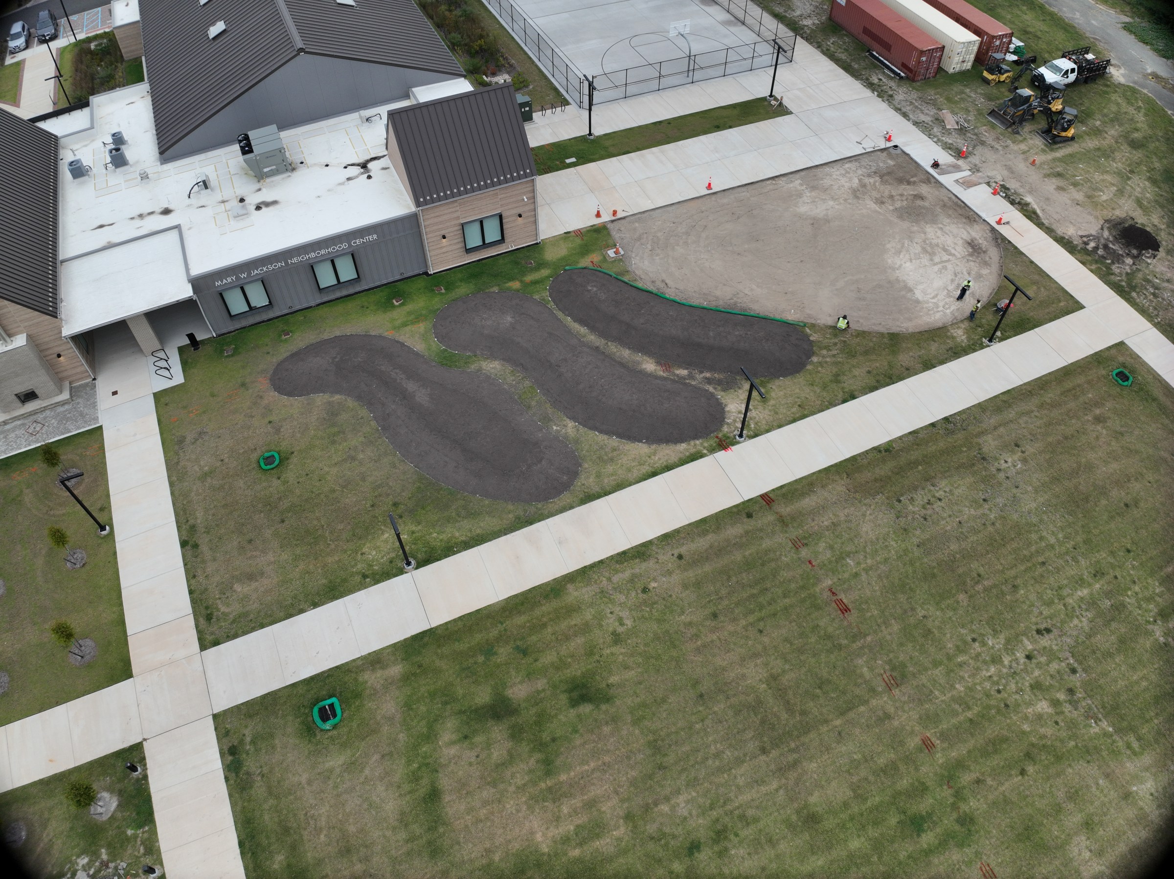 Graded play areas and connecting paths before the equipment is installed.